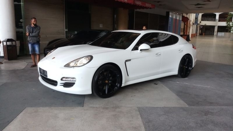 white Porsche Panamera at the Surabaya Porsche festival in Surabaya, Indonesia.