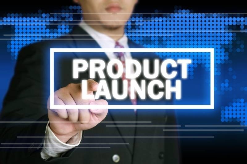 Business professional pressing a digital "Product Launch" button on a virtual interface.