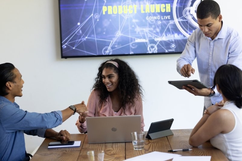 Diverse business team collaborating on product launch presentation 