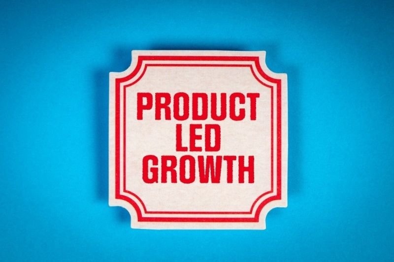 Product-led growth sign on a blue background.