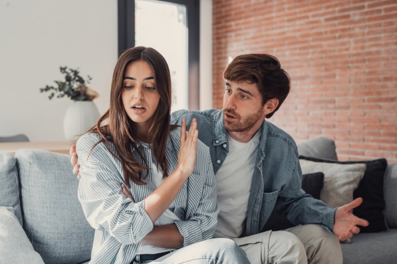 boyfriend trying to talk to his girlfriend