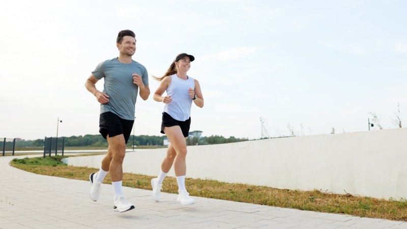 Couple running in the park in the morning