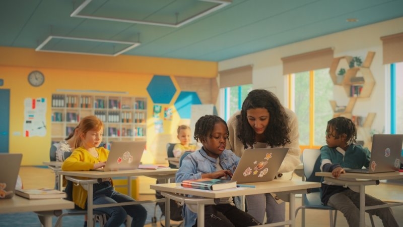 School Children Working on Their Laptop