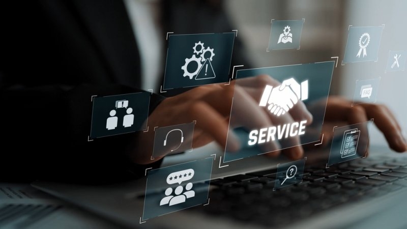 Digital customer service concept showing a laptop with a prominent “SERVICE” icon surrounded by communication, support, and rating symbols.