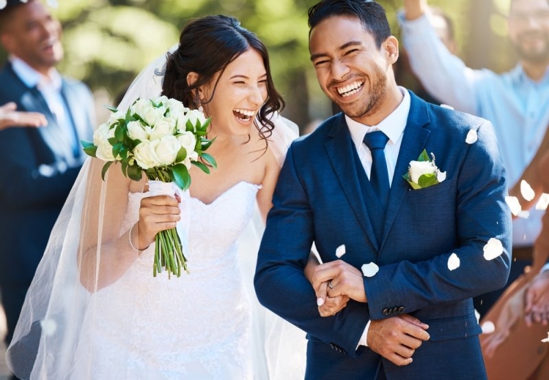 Just married couple walking down the aisle