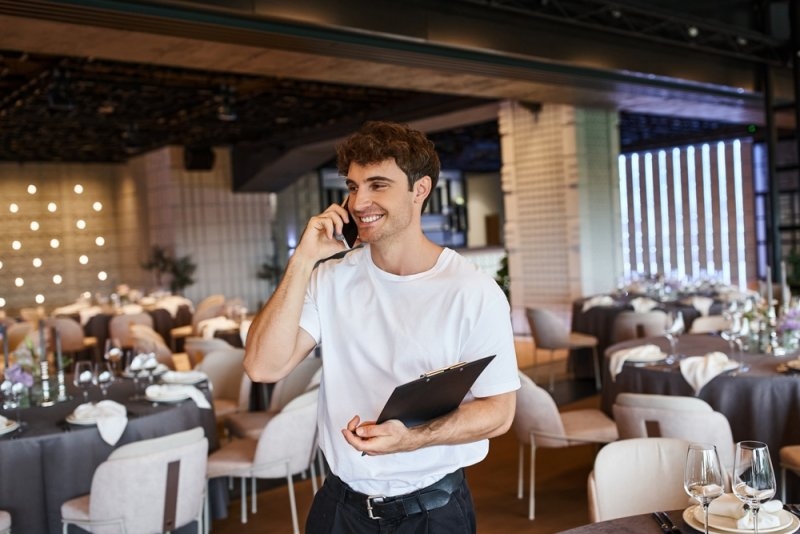 event coordinator organizing reservations and venue setup in a modern dining space