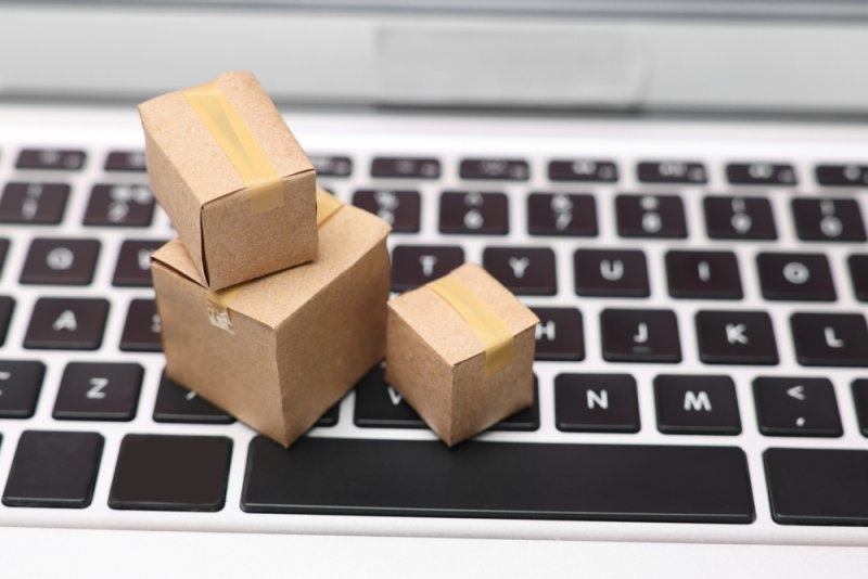 tiny cardboard boxes on a keyboard 
