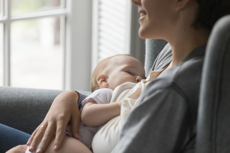 women breastfeeding her child 