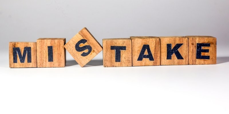 Text mistake words printed on wooden blocks