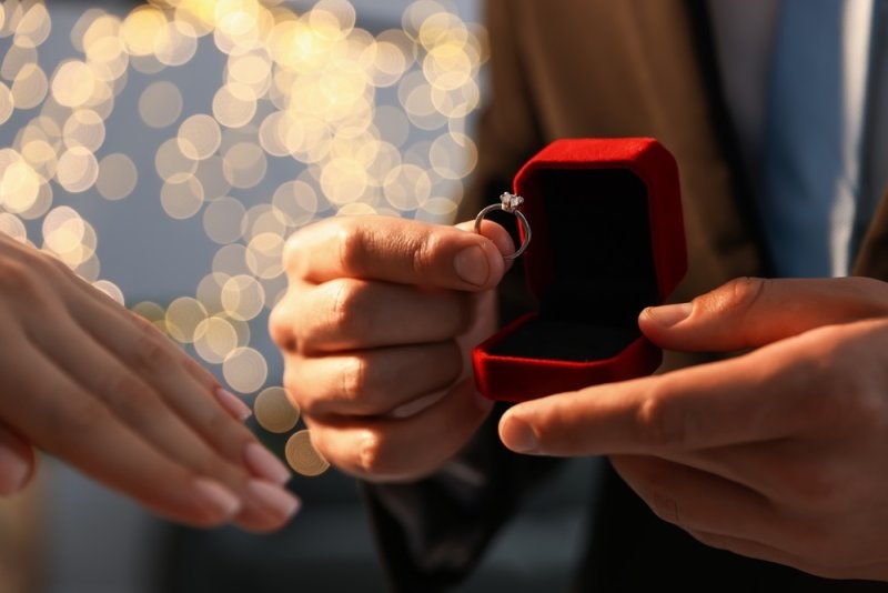 Man holding an engagement ring 
