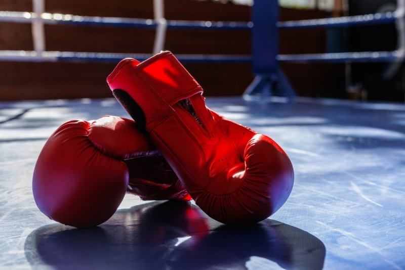 Boxing gloves on a boxing ring