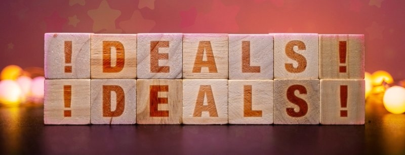 Wooden blocks spelling deals representing discounts, seasonal sales, and money-saving opportunities
