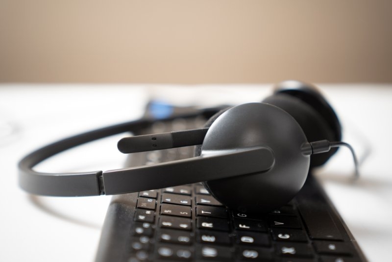 Keyboard and headphone on a table 