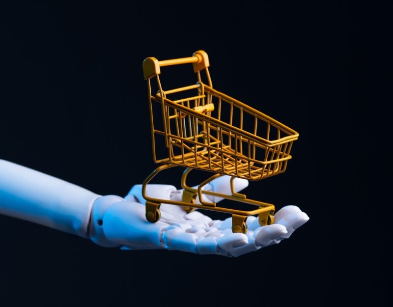Robotic hand holding a shopping cart