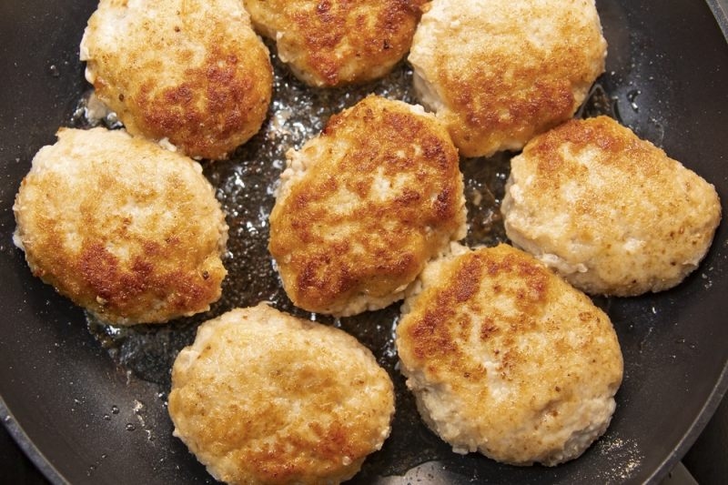 meat cutlets frying in pan 