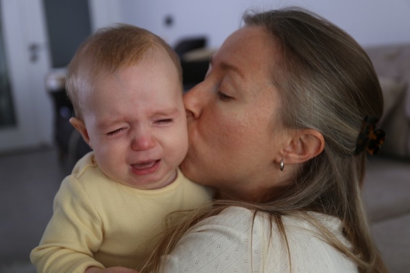 Mother soothing her crying baby