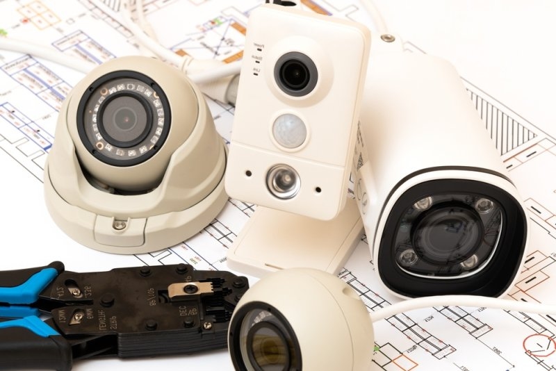 Various types of CCTV cameras on a table