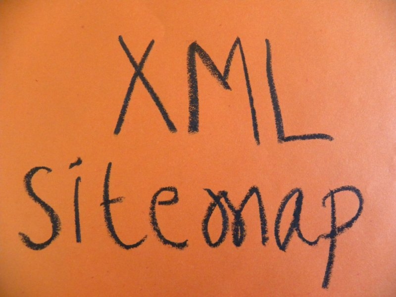 Handwritten “XML Sitemap” text displayed on an orange background.