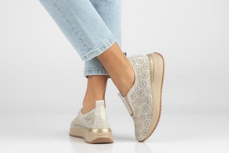 Women wearing printed slip-on shoes 