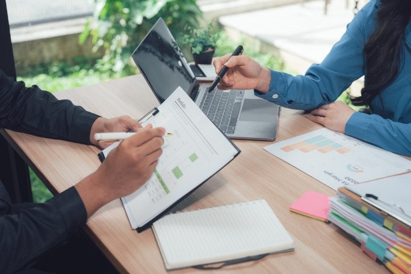 Business professionals discussing a work arrangement