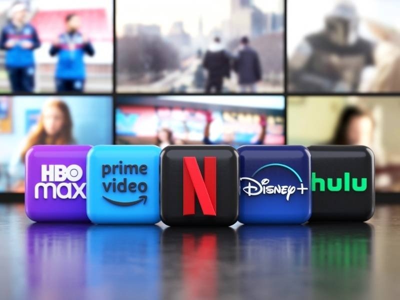 Logos of major streaming platforms displayed in front of a television screen.