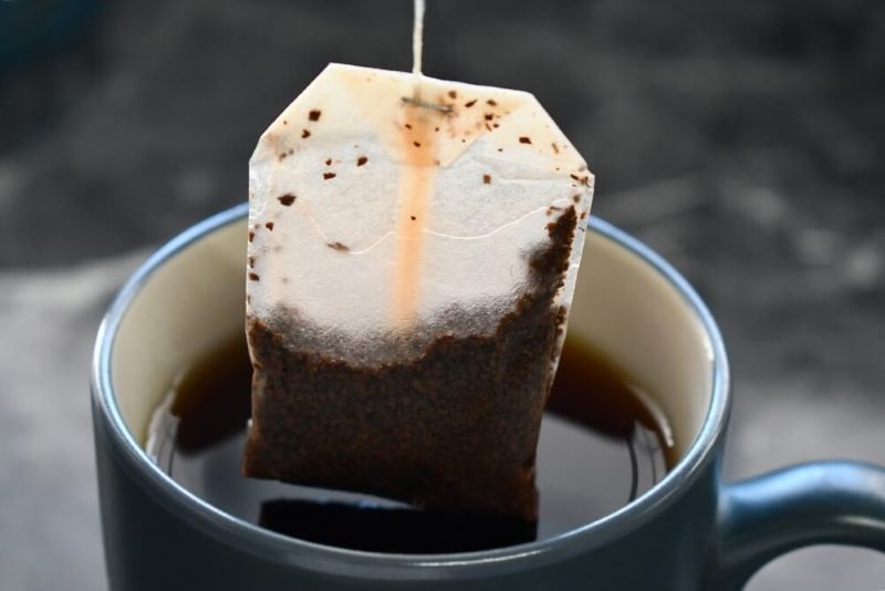 tea bag in hot water cup