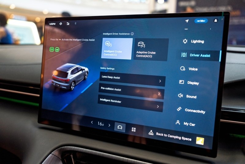 Car infotainment display showing intelligent driver assistance features, including adaptive cruise control, lane keep assist, and pre-collision assist.