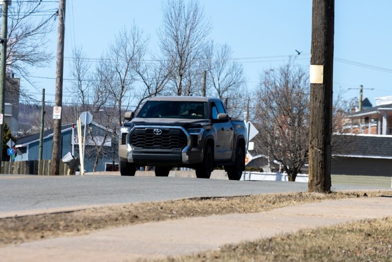 A black Toyota Tundra car on the road