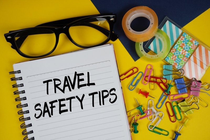 Text Travel Safety Tips printed on a notepad