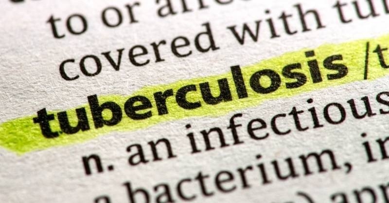 Close-up of the word “tuberculosis” highlighted in a dictionary or printed text.