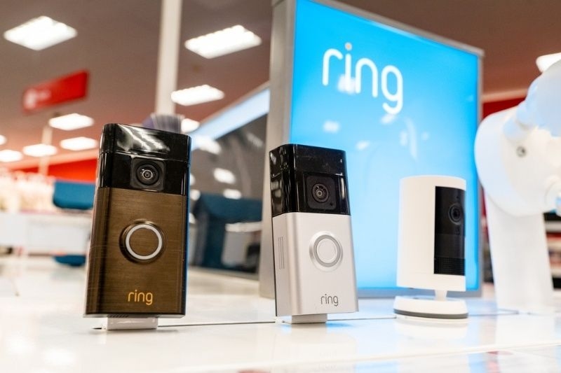 Ring smart doorbells and home security camera devices displayed in a retail store.
