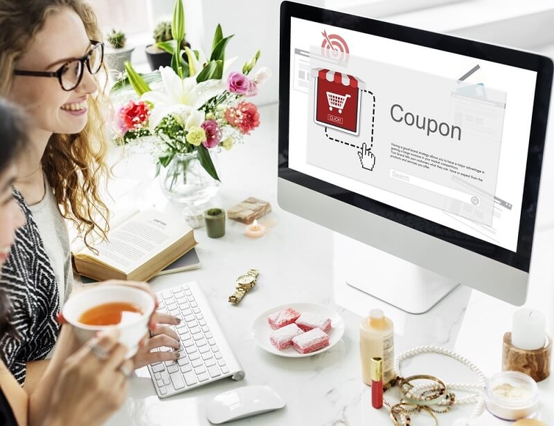 woman using coupon code in online shopping