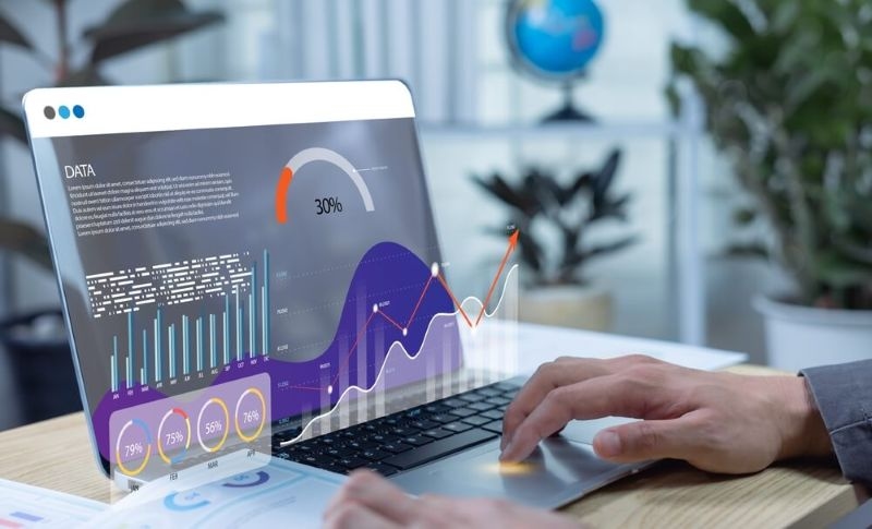 Businessman using dashboard for data management, KPI tracking and financial metrics connected to databases for finance