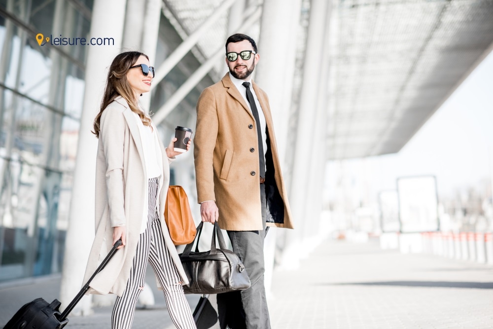 Man and woman with luggage at airport